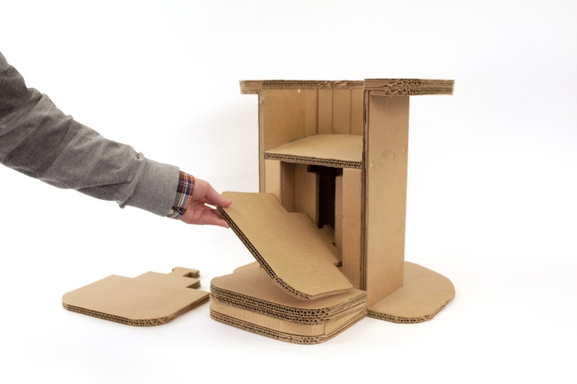 A cardboard chair from Perkins School for the Blind, with adjustable foot rests for customized support.
