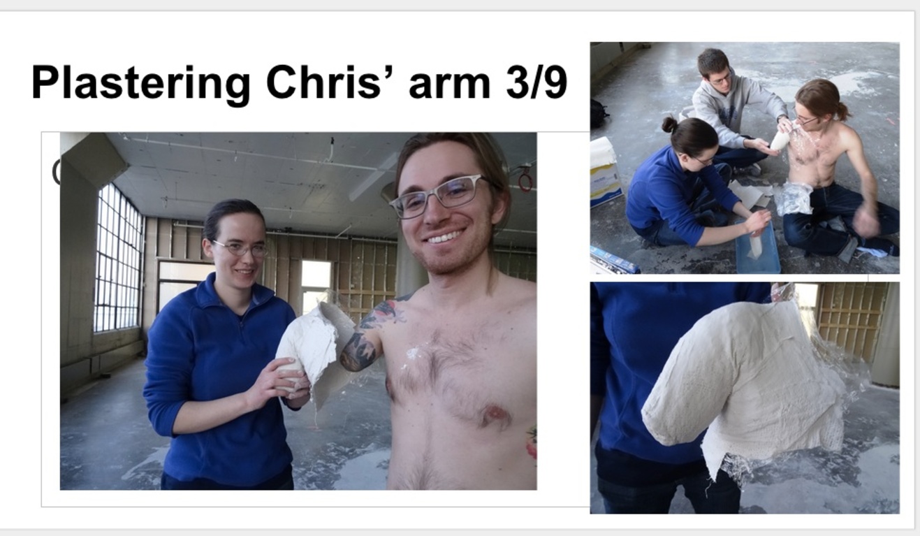Students measure Chris's arm for proper fabrication.