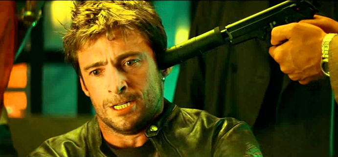 A picture of Hugh Jackman in Swordfish with a gun to his head.