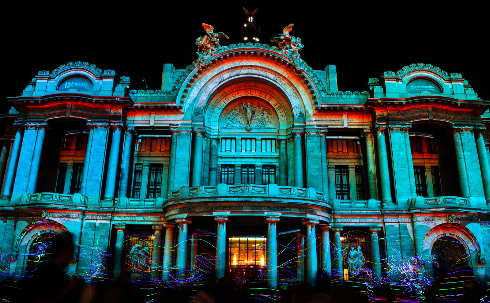 neon-colored video mapping on the Palacio de Bellas Artes in Ciudad de México, Mexico