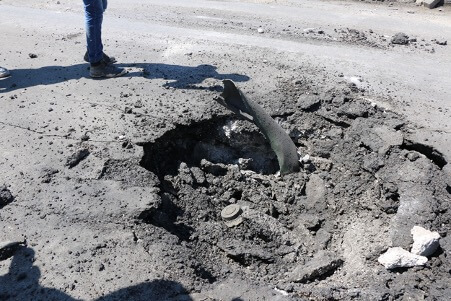 Photo shows remnants of an M4000 aerial bomb that landed on an asphalt road, which damaged part of street and settled in the crater. This photo was taken after a chemical attack in Khan Shaykhun in April 2017. The photo was published in a Human Rights Watch report in 2017.