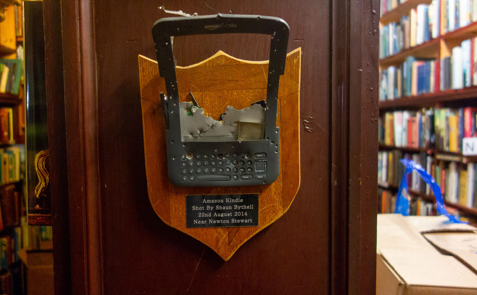 smashed kindle mounted on a plaque