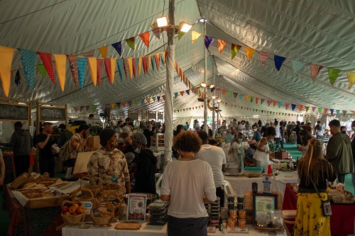 Interior of marquee with many stalls setup