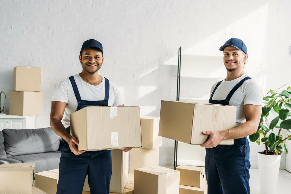 professional movers carrying boxes