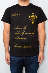 a black blessed and redeemed shirt, with yellow text on it reading a bible quote