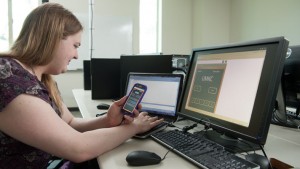 Sarah working on a mobile app