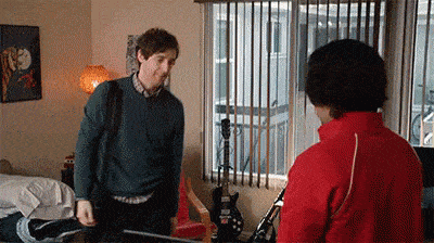 awkward handshake hug high-five gif