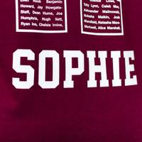 A hoodie with a student's first name printed on the back below the large number.