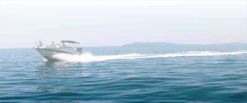 A speed boat making a path in water A speed boat making a path in water