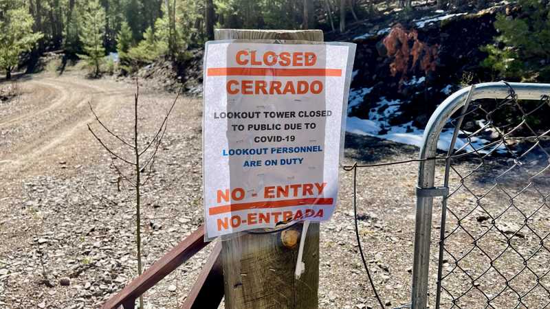 A sign announces the road to the lookout tower is closed