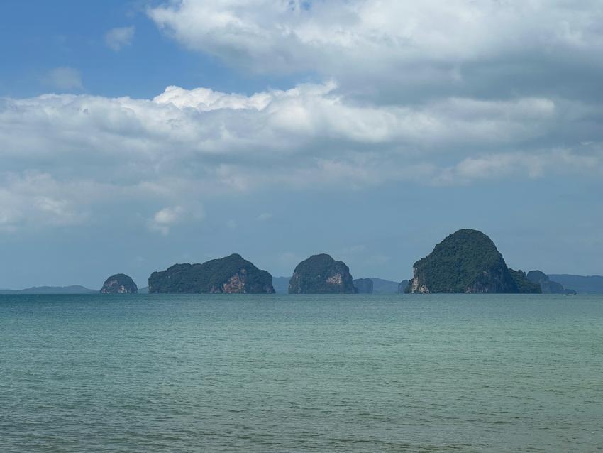 A view of 4 small islets out in the ocean