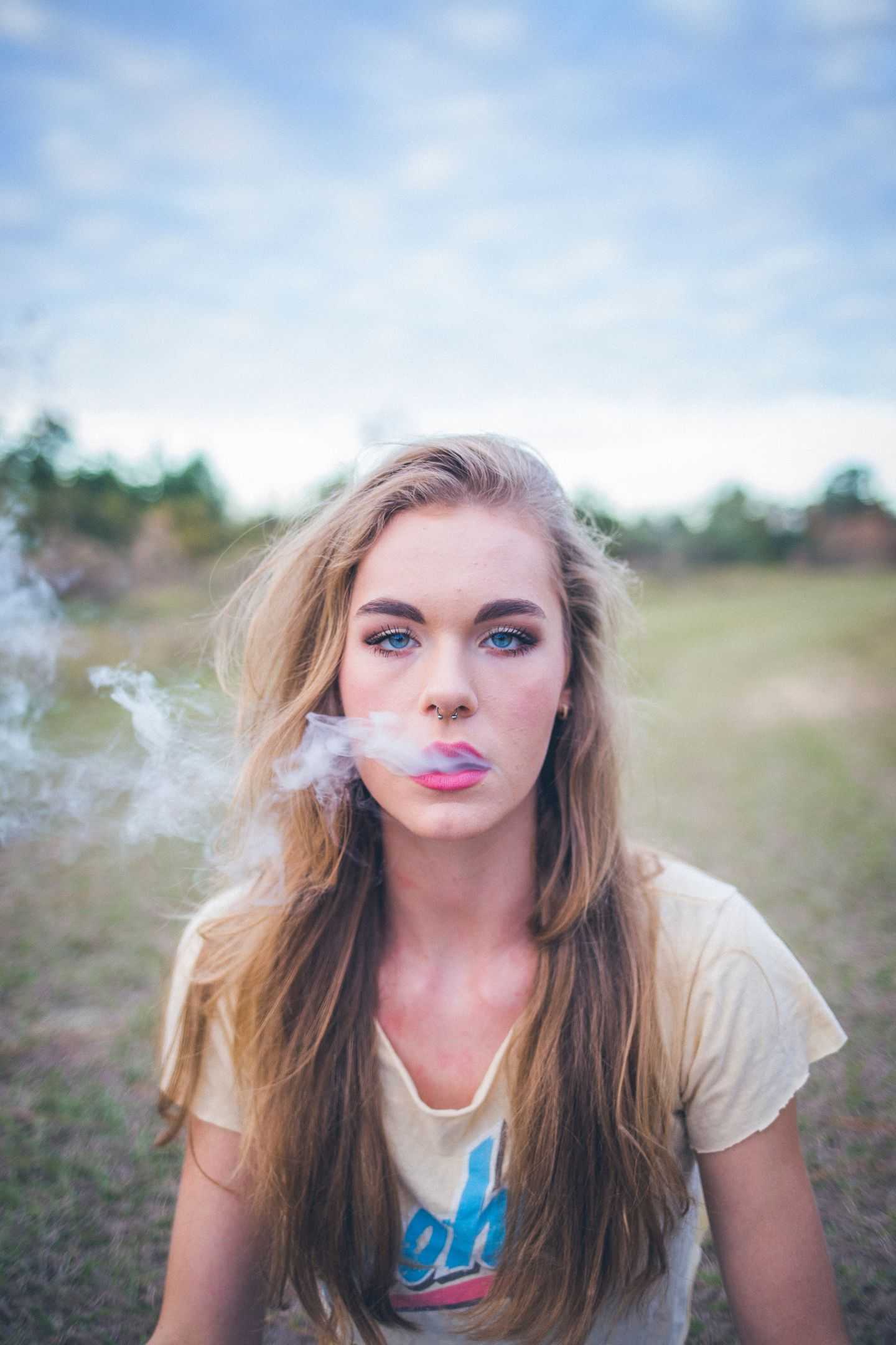 Girl smoking outdoors