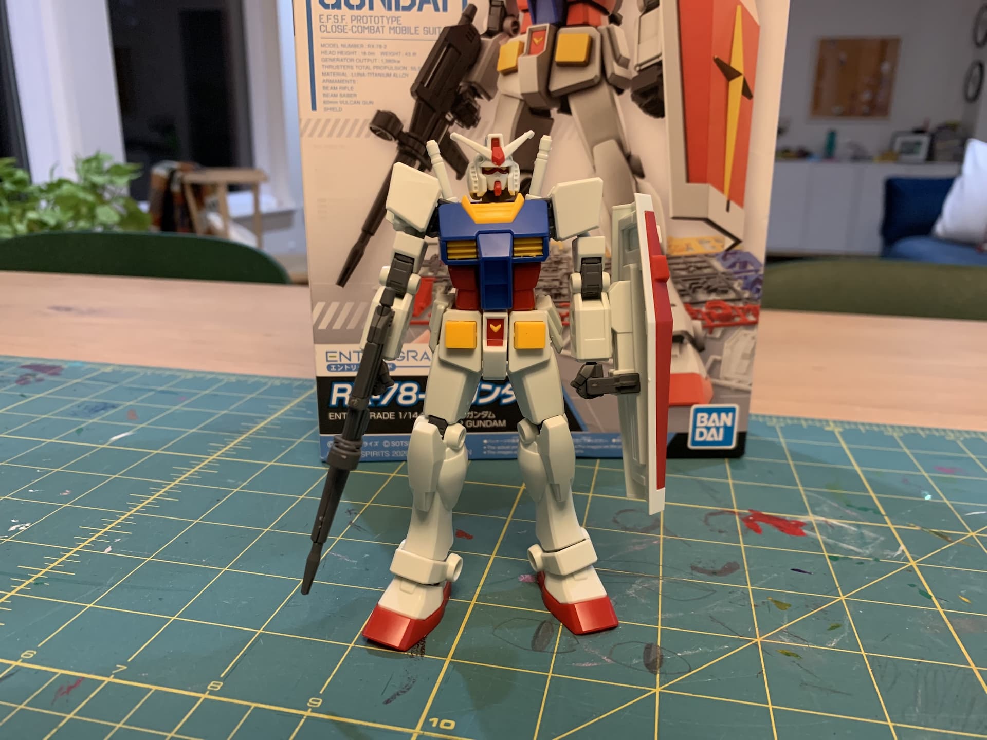 A small plastic model Gundam robot