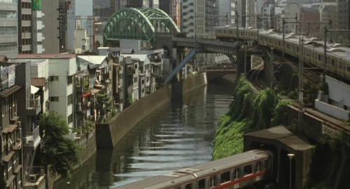 A screenshot looking down on the famous Ochanomizu train tracks. From the film 'Cafe Lumiere'.