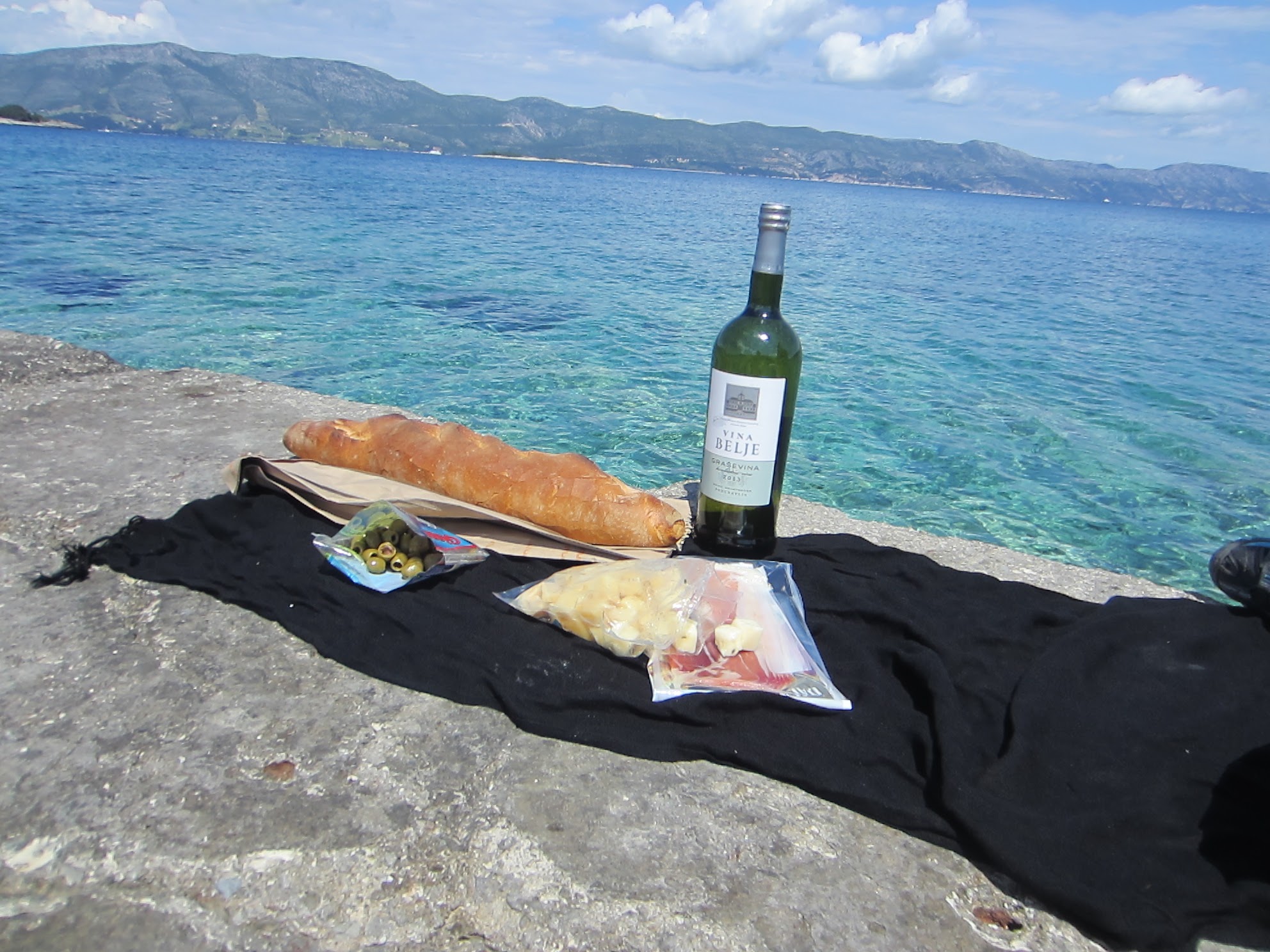 Picnic lunch of the pier at Lumbarda Beach. Despite the closure of most wineries, we still managed to get our fill of good wine.
