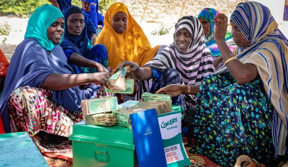 Members of the Janagal self help group in Somalia counting their profits.