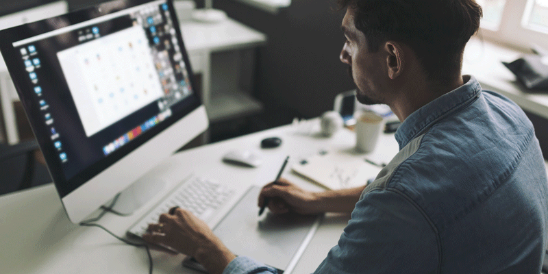 What is a full-stack designer – and how to become one A full-stack designer sitting in front of a computer screen