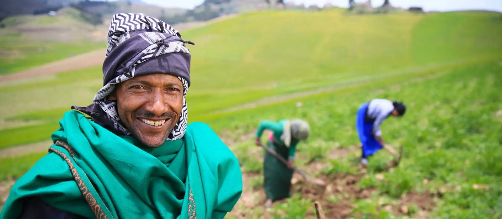 Ali Assen Ali, with two of his daughters, on their potato farm 12,000 feet up in the highlands of South Wollo, Ethiopia.