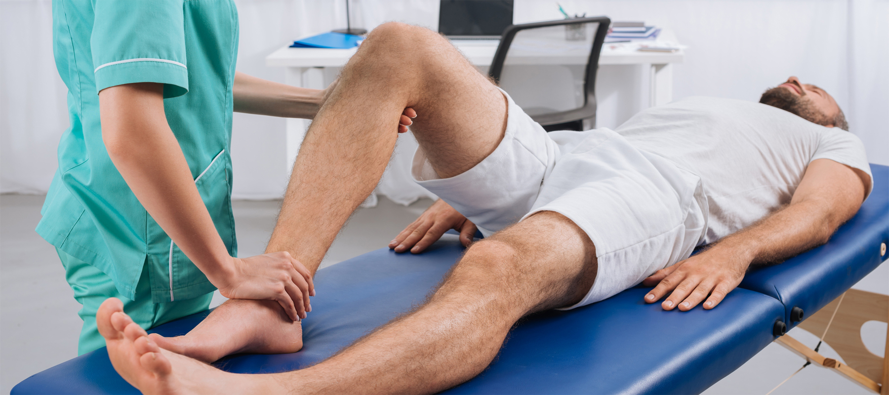 Physical Therapist Giving Man Treatment