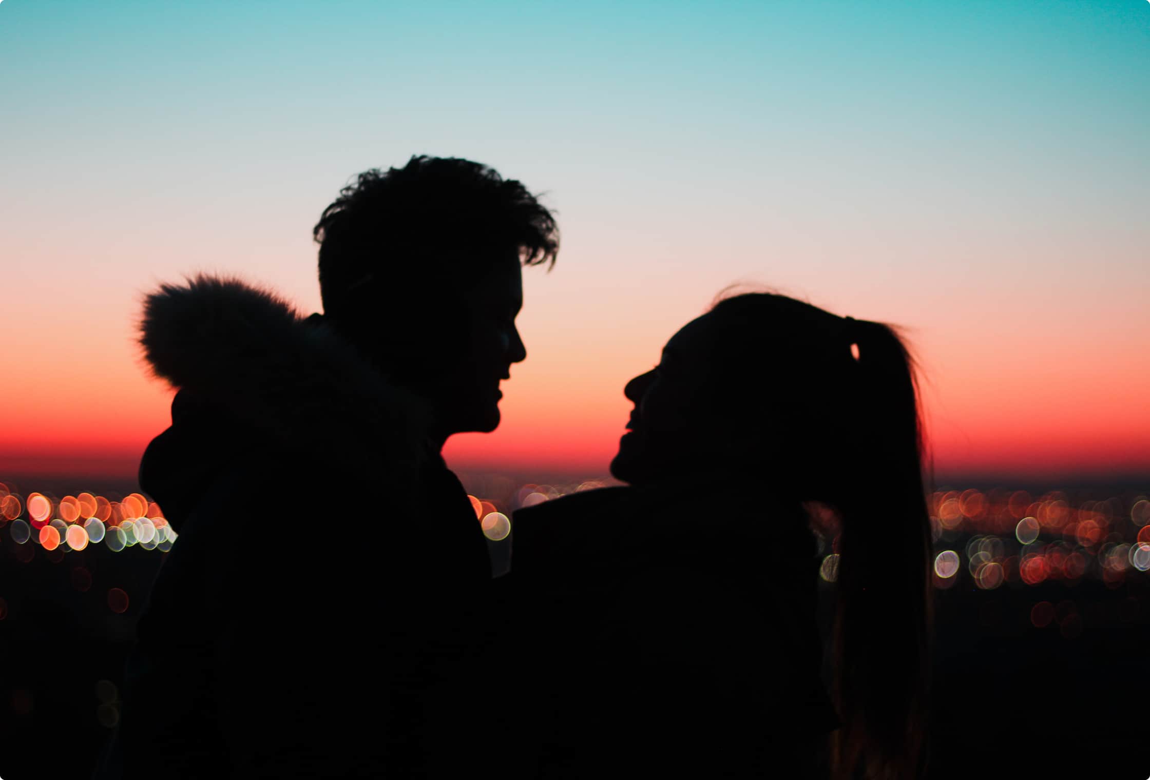 Two people dating on a sunset view