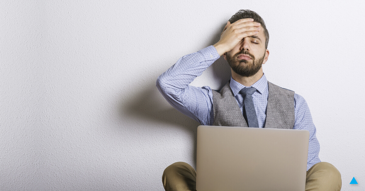 A frustrated man at his computer. Learn why your site has no traffic.