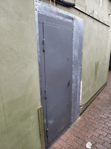 High security door with sheet metal