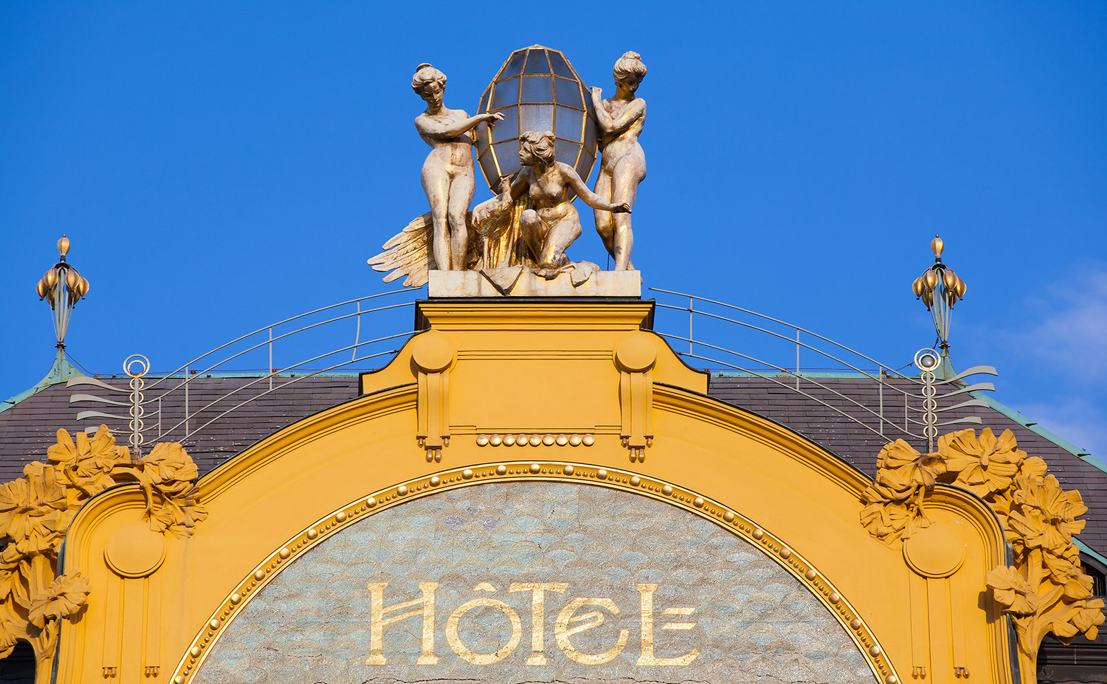 the facade of the hotel europa in prague against a blue sky