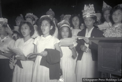 Christmas carollers singing at church, 1951