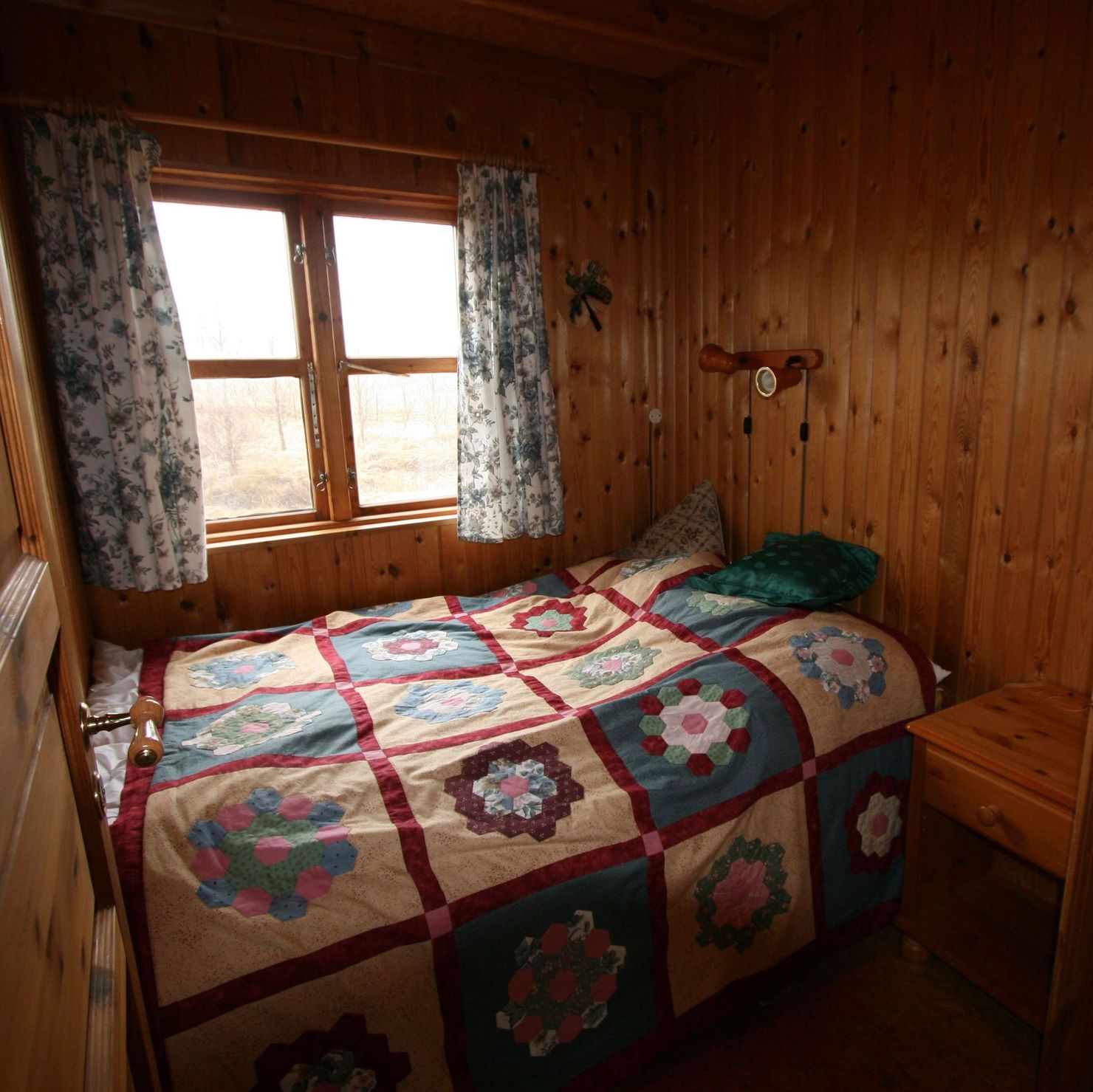 Cosy bedroom with double bed and window
