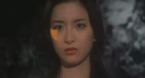 An animated gif of a scene from Japanese film 'House' showing the face of Gorgeous break off to reveal fire underneathe.