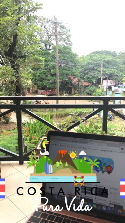 photo of laptop with jungle background. Greenery and costa rica title over photo.