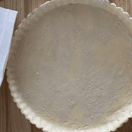 Pre-heat the oven to 425°F. Roll out your pie crust and place it in your baking dish (a 9" pie plate, 8-10" cast iron pan, or 9.5" tart pan all work). Dock the dough with a fork and return to the fridge until your oven is done preheating.