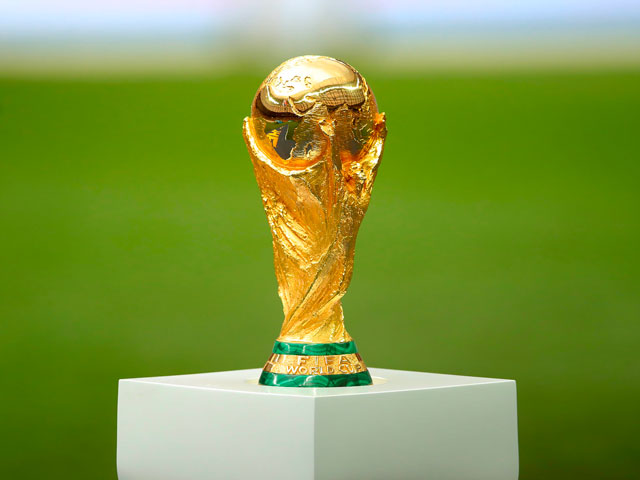 The golden Fifa World Cup Trophy resting on a pedestal.