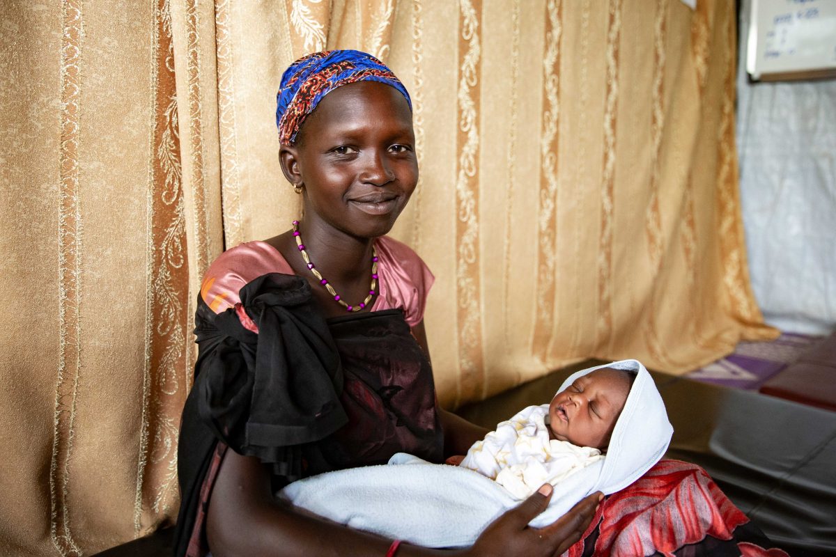 Woman in Gambella region of Ethiopia with newborn baby