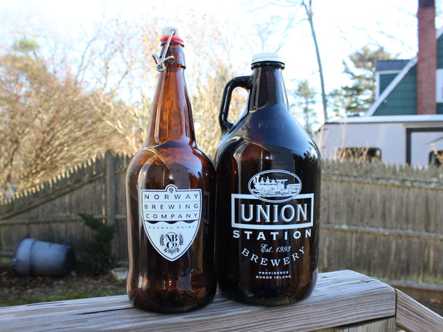 A pair of glass growlers in different shapes and sizes