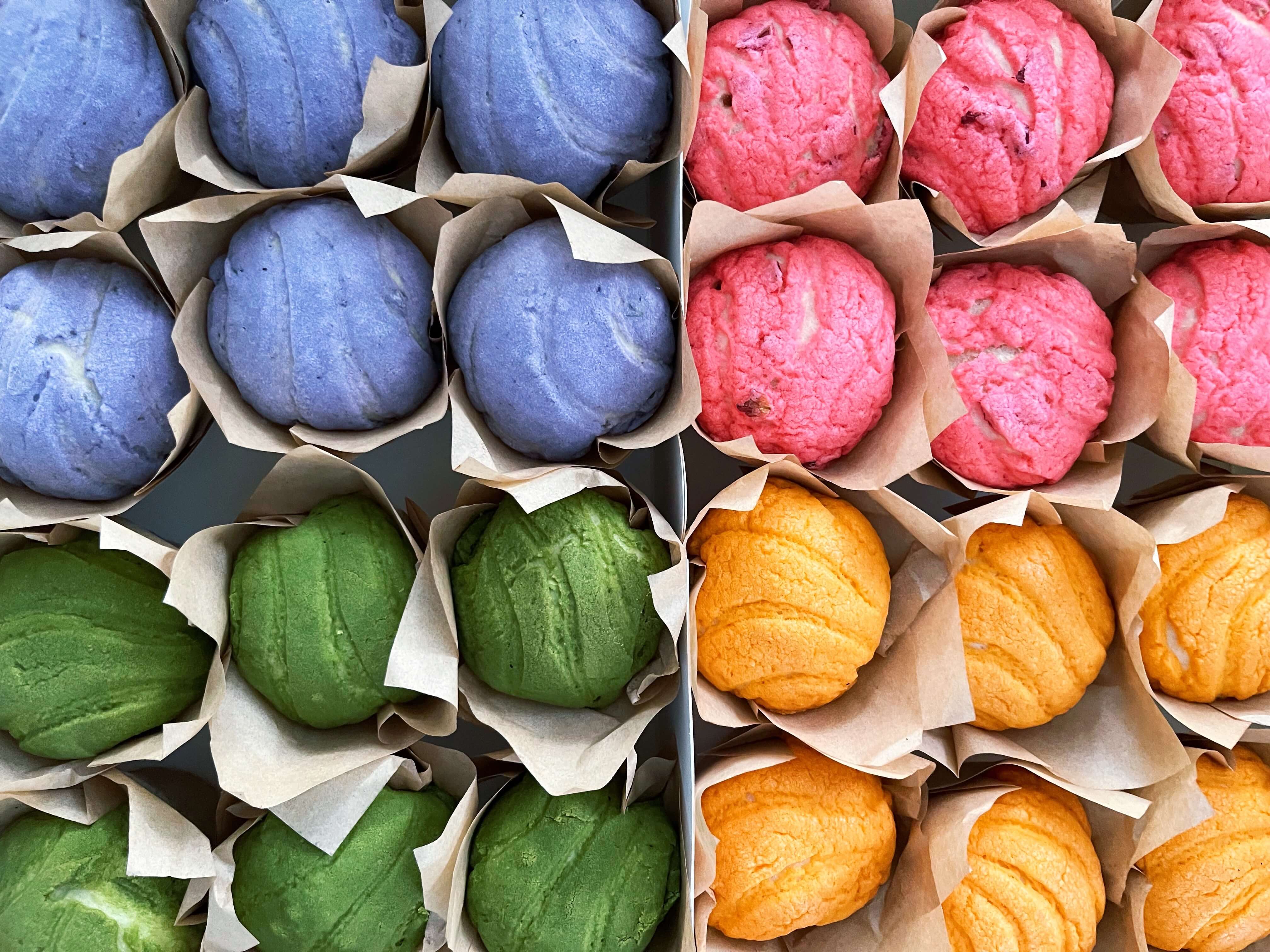 an asortment of colorful conchas