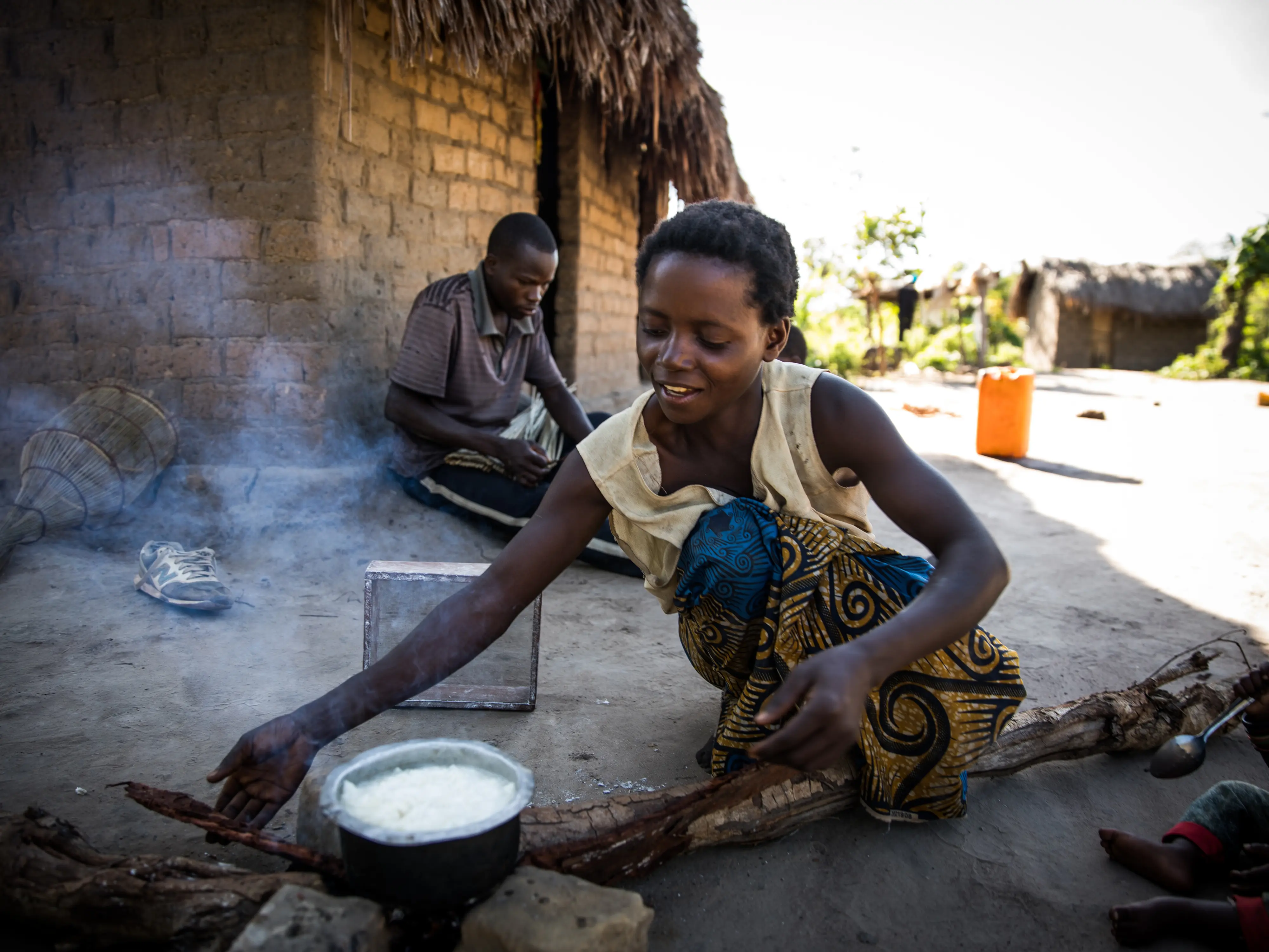 Congolese woman prepares breakfast for her family in Manono Territory, DRC