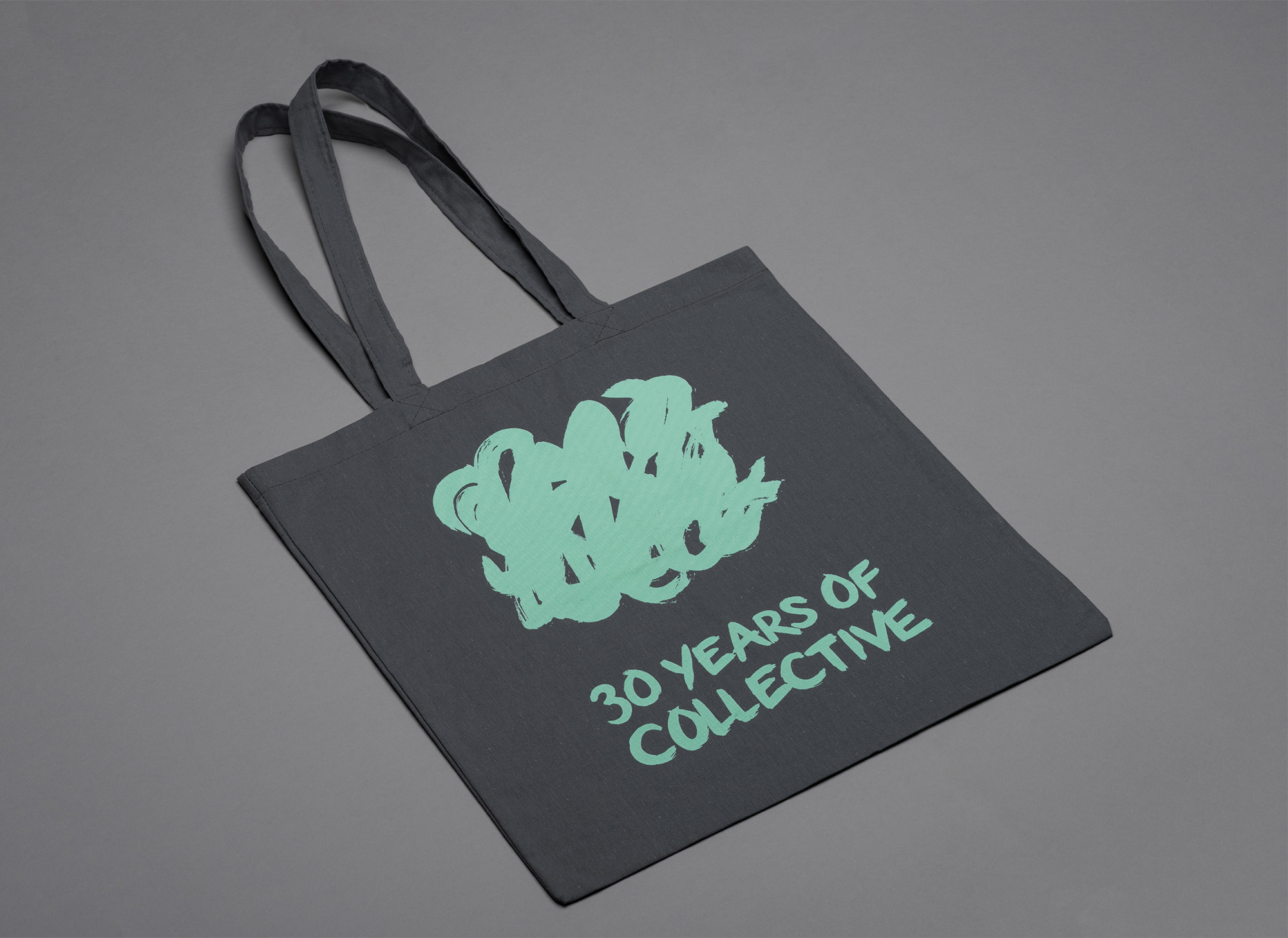 Green '30 years of Collective' screenprinted on a tote bag