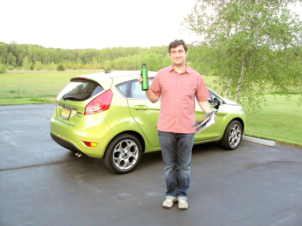 Picture of Sean McBride in front of his Ford Fiesta with matching water bottle