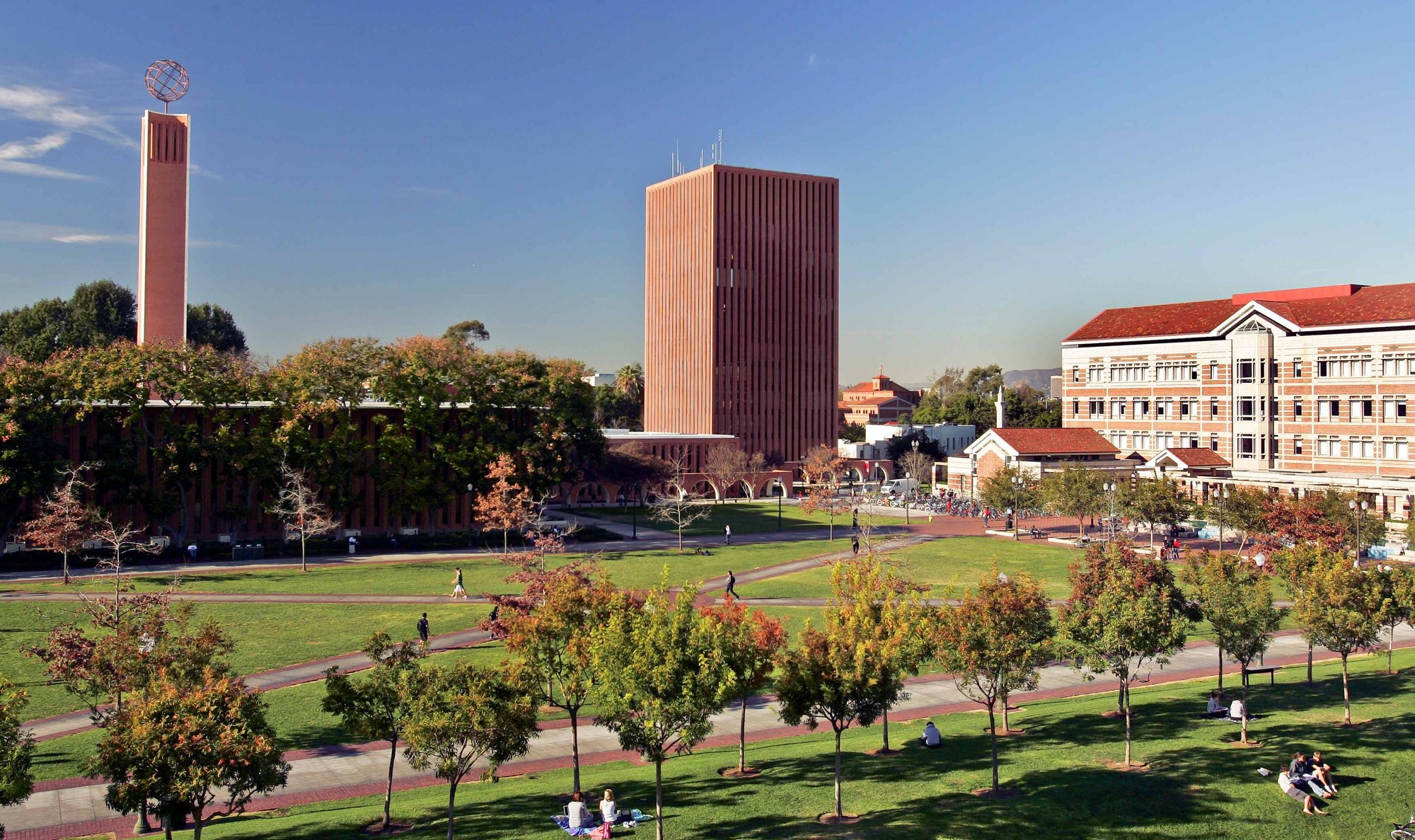 A view of USC's Rossier School of Education buildings with the grass quad in the foreground
