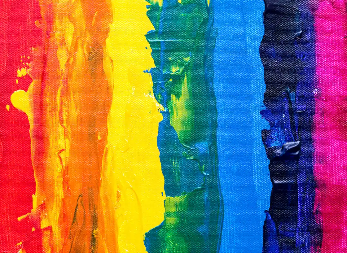 Abstract painting with colored stripes in hues of red, green, and blue from left to right forming a rainbow.