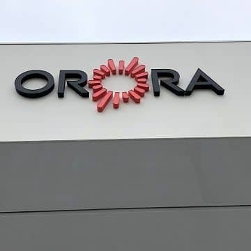 logo of a company called orora against newly painted grey exterior walls