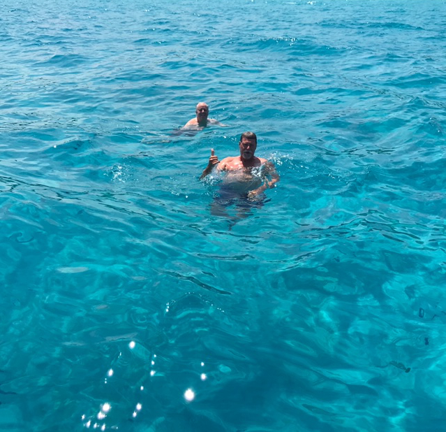 Two men floating in the Mediterranean Sea