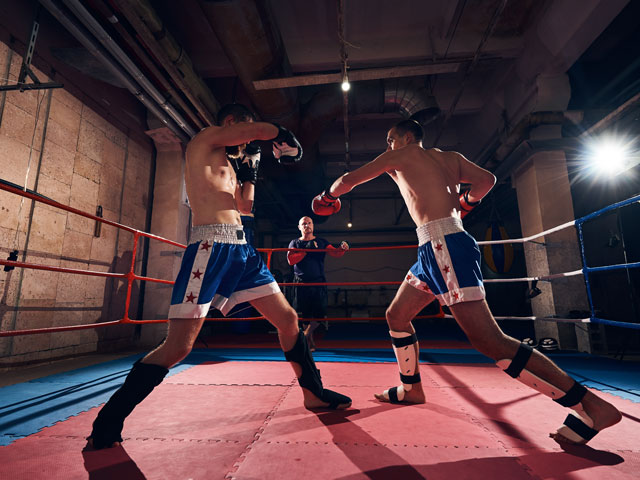 Two boxers in a boxing ring