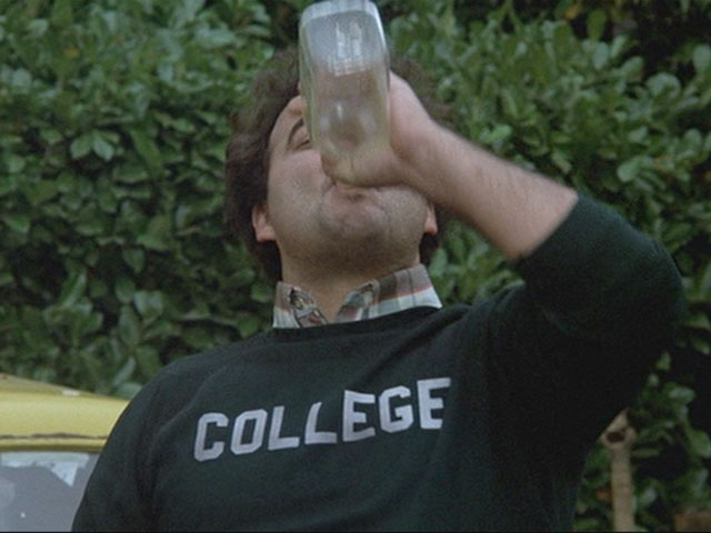 Bluto chugging the Jack Daniels and playing the Animal House Drinking Game