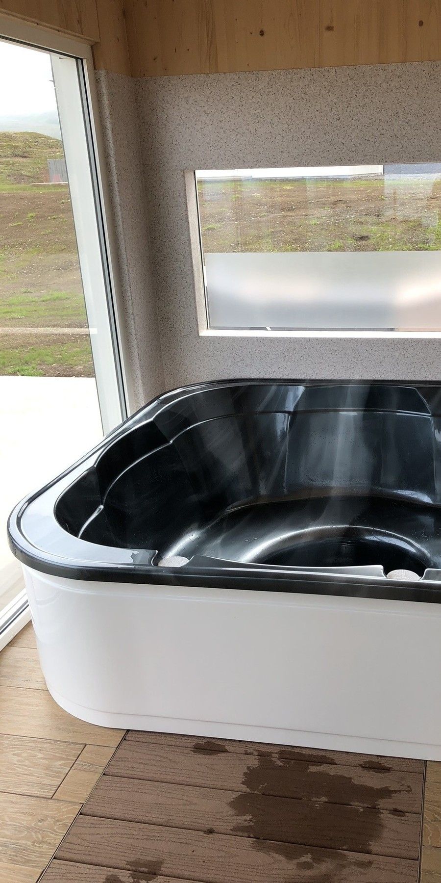 The private hot tub is protected from view and the weather