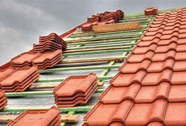 Roof being tiled