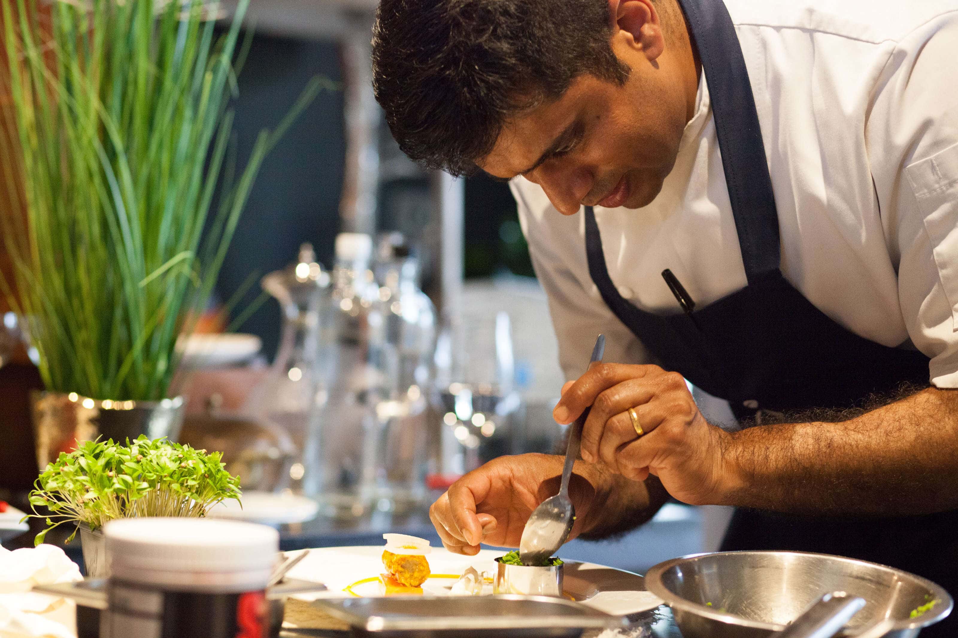 Hrishikesh Desai prepping a dish for a food photography shoot at the Gilpin Lakehouse in Cumbria.