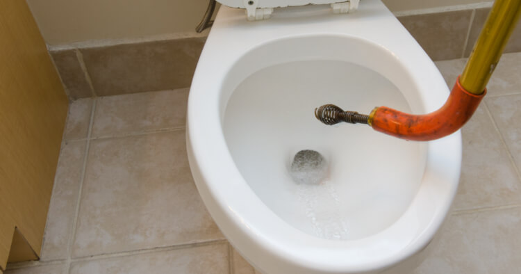How to Unclog a Toilet With a Snake or an Auger