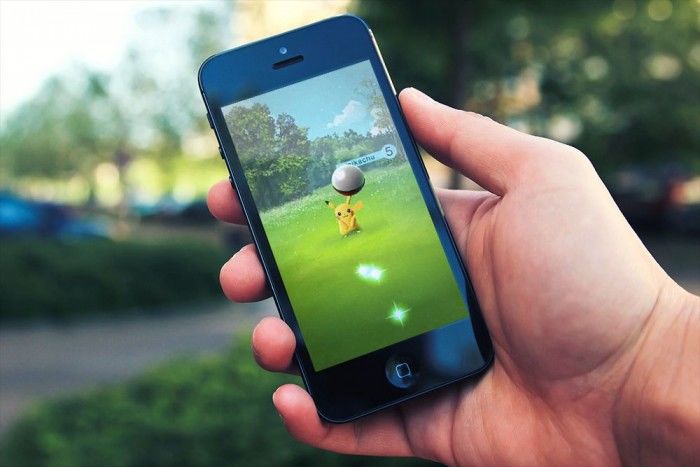 Phone with Pokemon Go open on screen